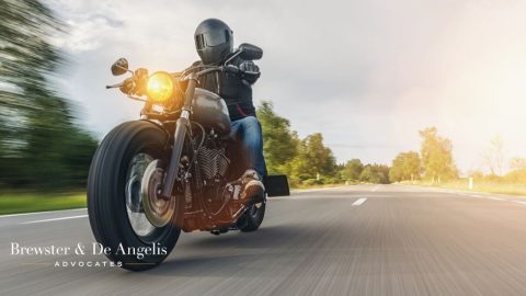 Riding a motorcycle on highway.