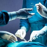 Medical professionals perform surgery