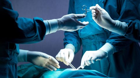 Medical professionals perform surgery